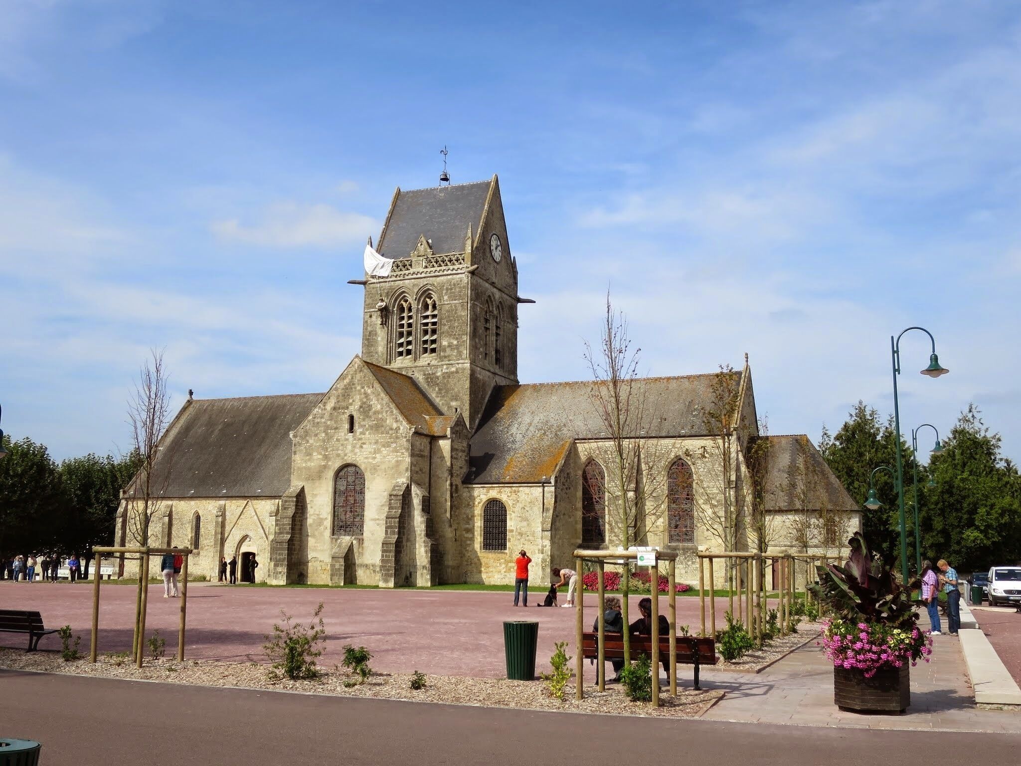 A historic church with a tall bell tower and arched windows.