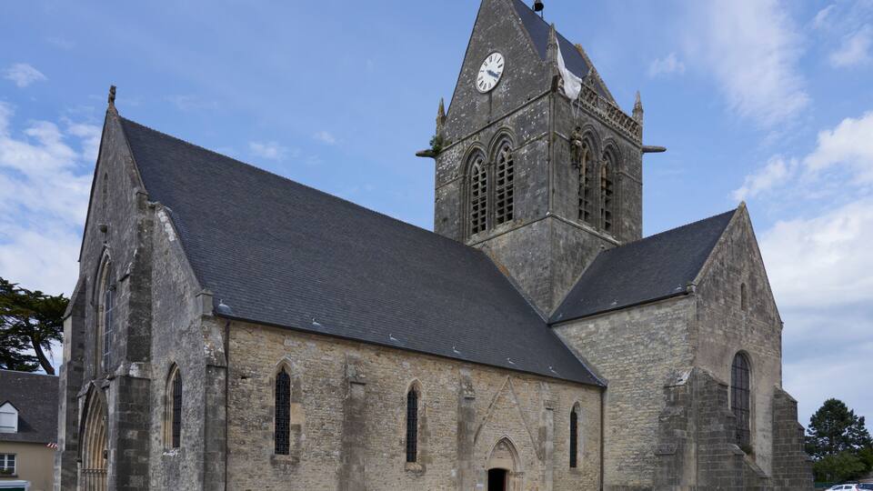 A historic church with a clock tower and arched windows.