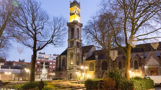 Valenciennes, France, 2017-01-05. The steeple with a bell and a clock of Saint Gery (Gaugericus) church at dusk.