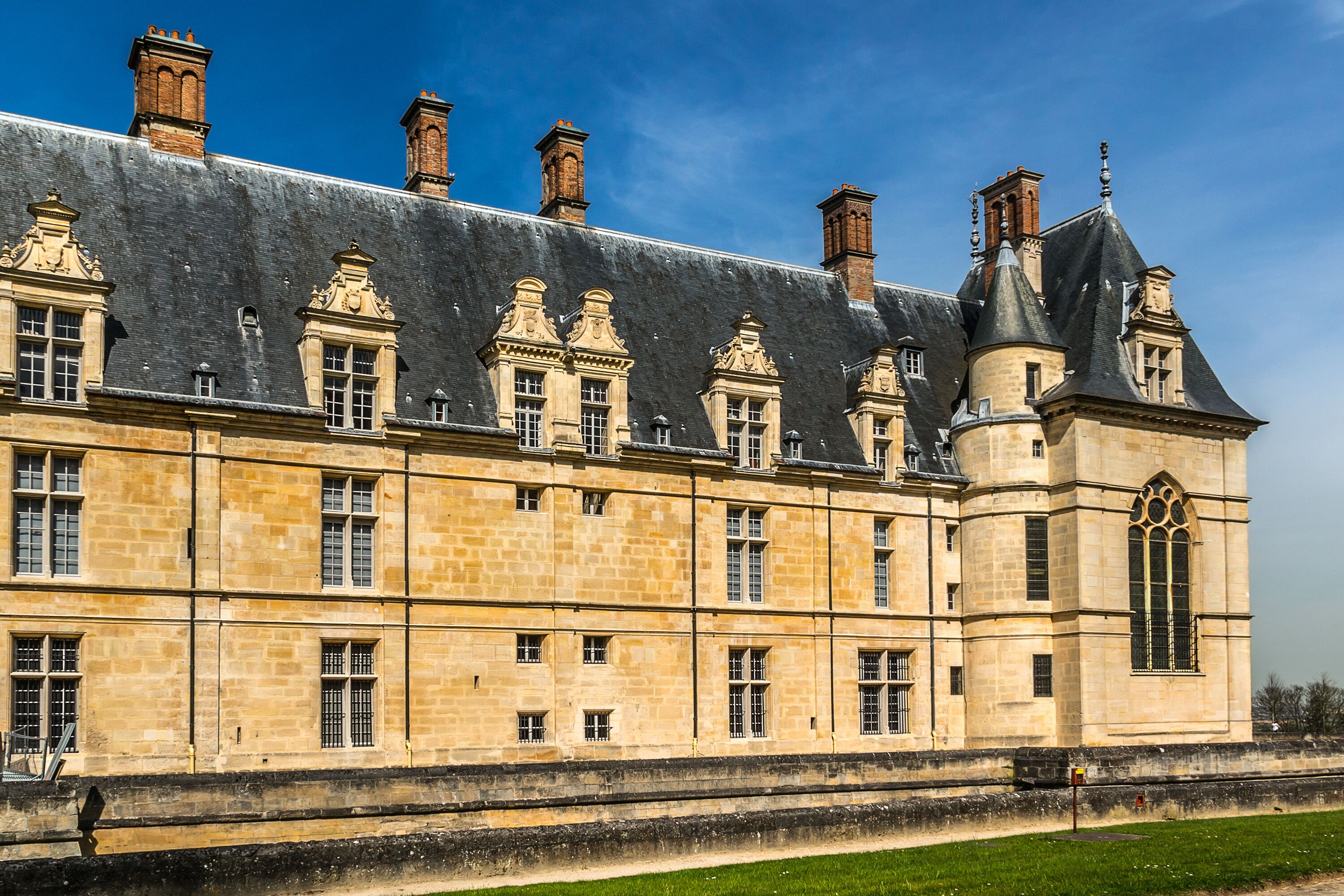 Architectural fragments of Cheteau Ecouen - historical chateau in city of Ecouen, north of Paris, France. Chateau built in 1538 – 1550.