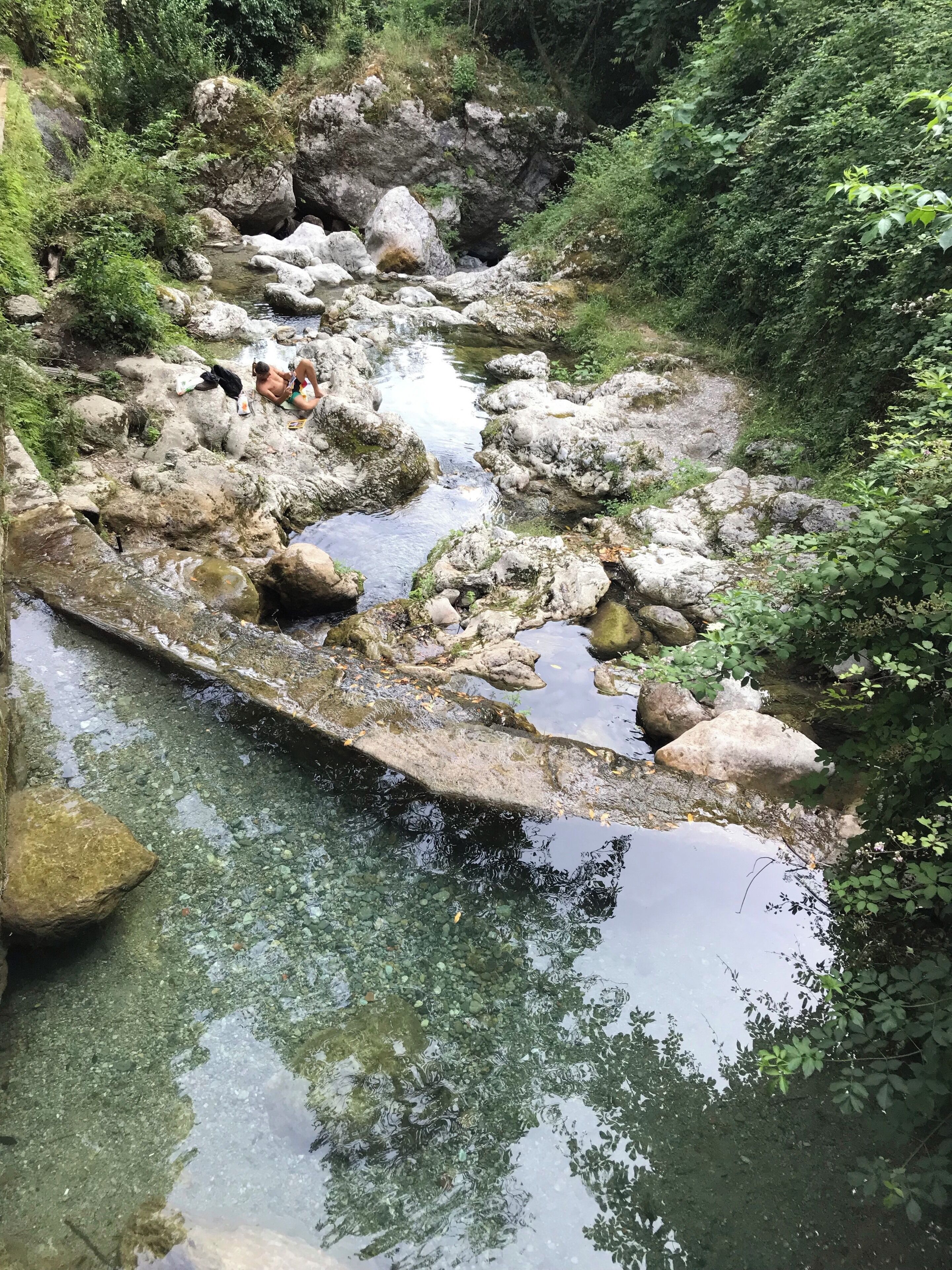 A series of mountain stream pools you can swim in, with derelict mills to photograph. This was taken at the bottom,  where the local kids challenge each other to jump in from ever higher ledges.