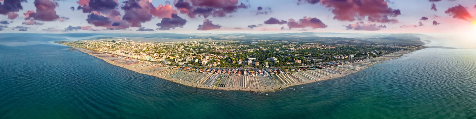 Panoramic aerial view of Lido di Camaiore and Viareggio coastline in summer season