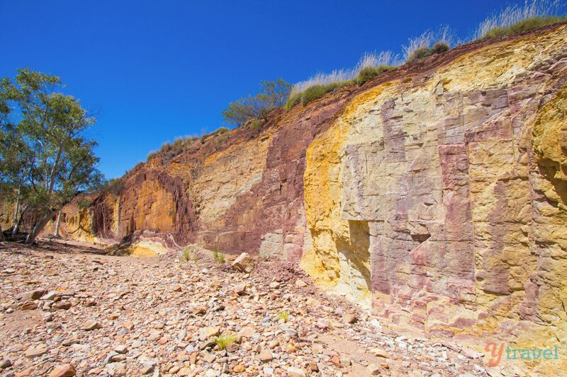 The "Ochre Pits" was a cool place to visit on our drive along the Red Centre Way drive, about 100 kilometres from Alice Springs in the Northern Territory of Australia. 

The pits consist of multi-coloured layered rock traditionally used by the aboriginal people for painting and decoration in ceremonies, still used today!