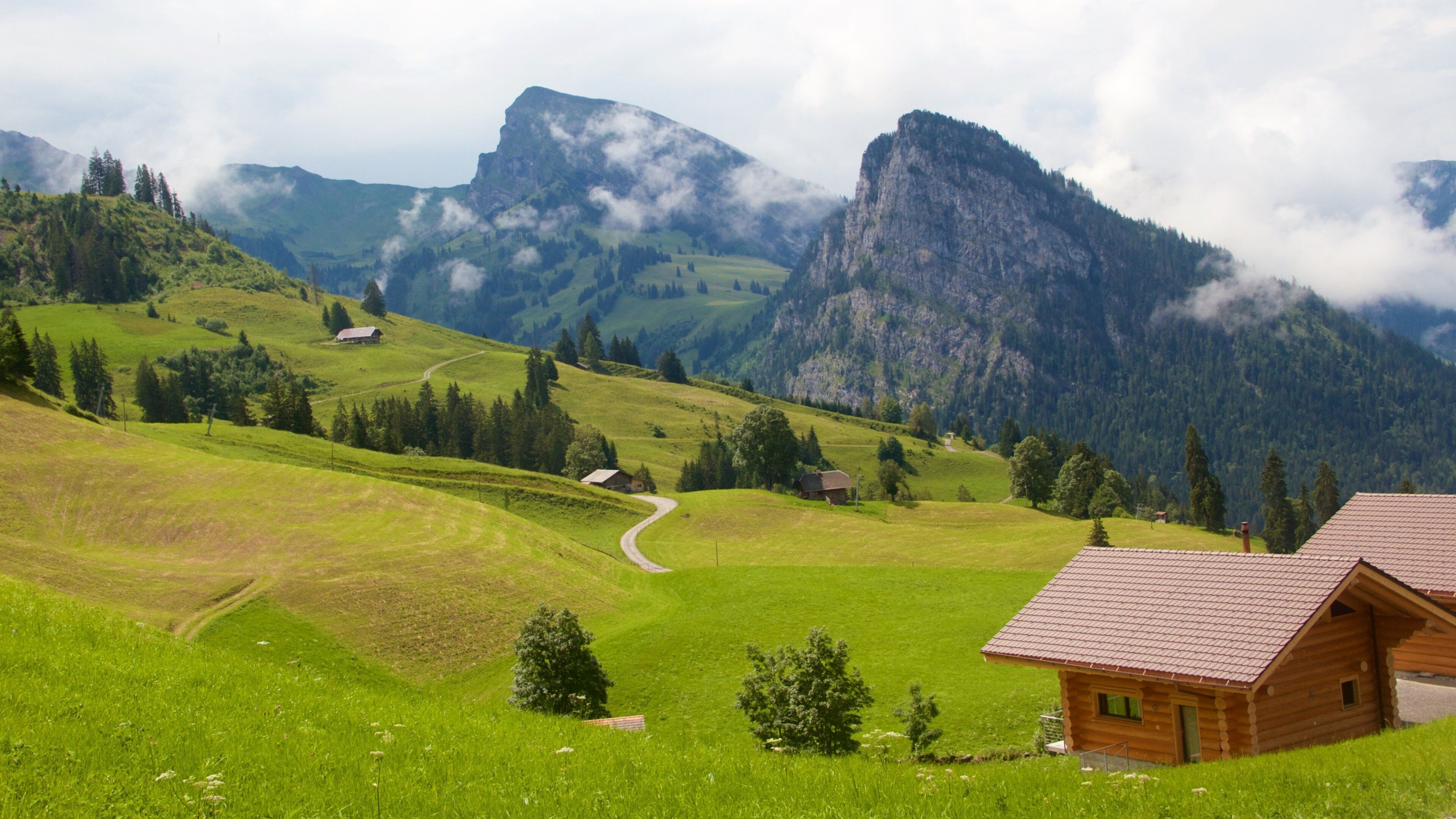 Bernese Alps which includes tranquil scenes, a house and mist or fog