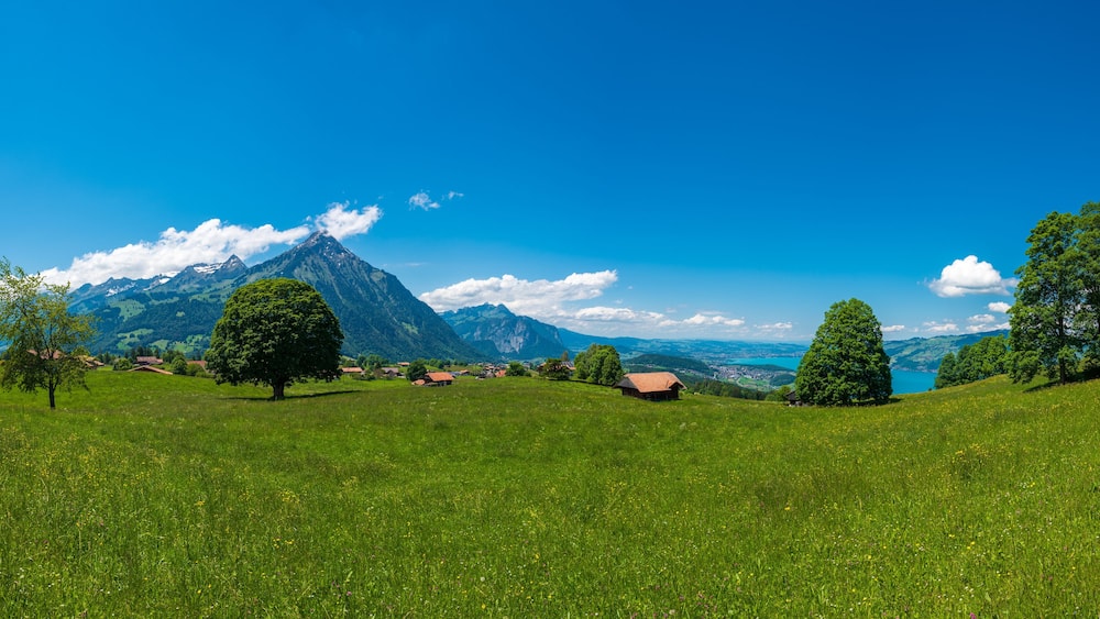 Panorama overlooking Mount Niesen, Lake Thun and the village Aeschi bei Spiez