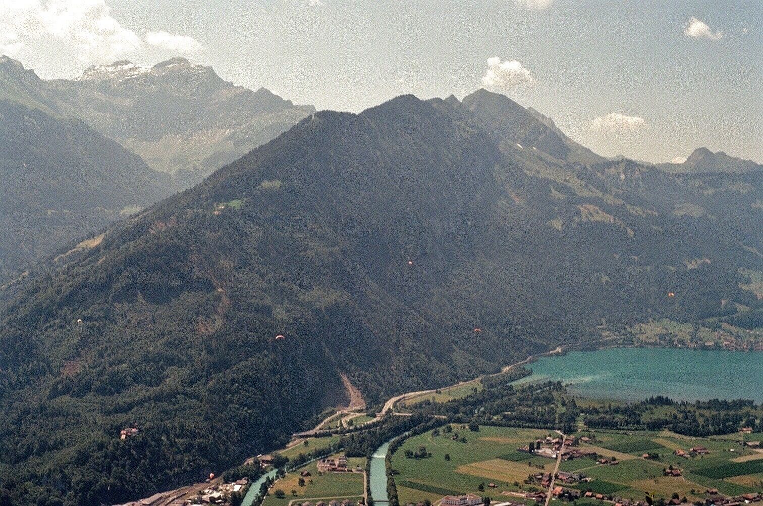 The view from the top of Interlaken cannot be beaten. Look closely, you may see some parasailing folk! I wanted nothing more than to soar over the city too, but with my budget, it wasn't possible. Hiking to vistas like this was the next best though! Taken with Kodak 400 #adventure #35mm