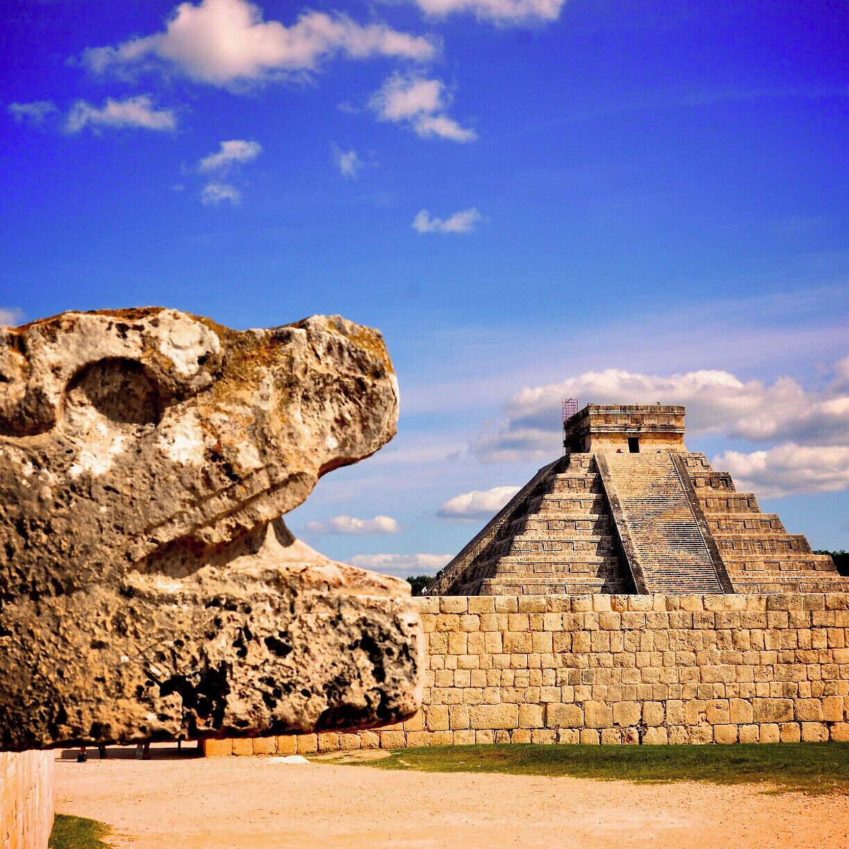 Chichen Itza was a large pre-Columbian city built by the Maya civilization. Here you have the serpent from the ball court and the Kukulcan temple in Chichén-Itzá Maya site, Yucatan, Mexico