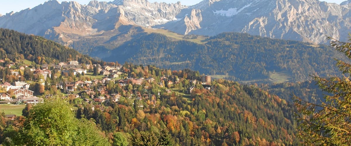 A mountainous landscape with a town nestled in the valley.