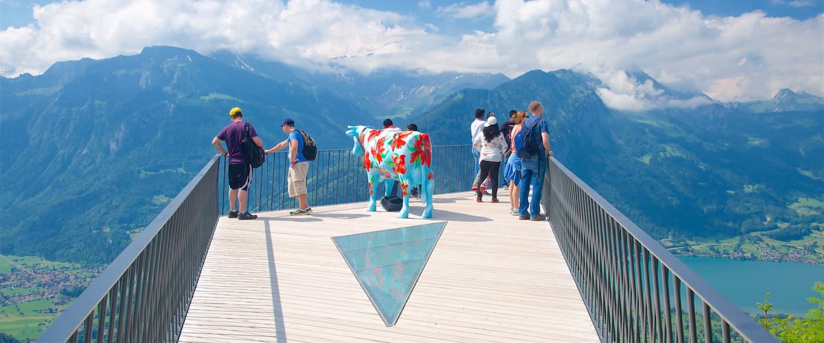 Switzerland featuring outdoor art and views as well as a small group of people