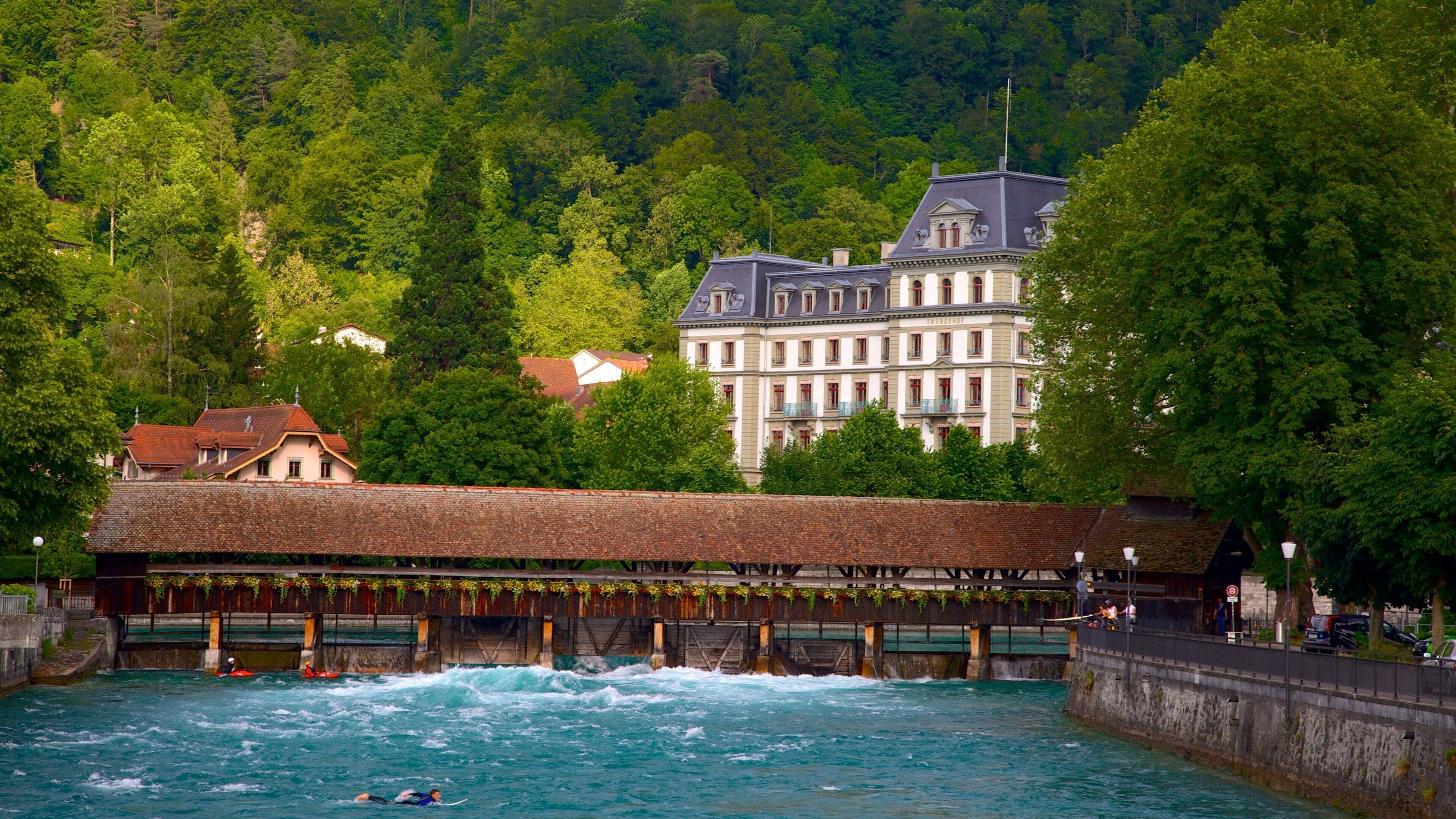 Thun which includes a river or creek and a bridge
