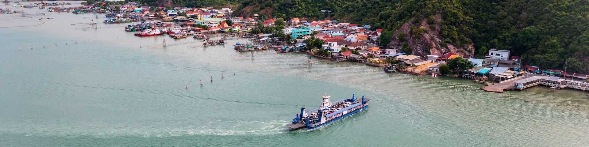 Car ferry across Songkhla Lake to Singhanakhon. Aerial view of ferry-boat with Songkhla ancient town at Hua Khao, Singhanakhon, Songkhla.
