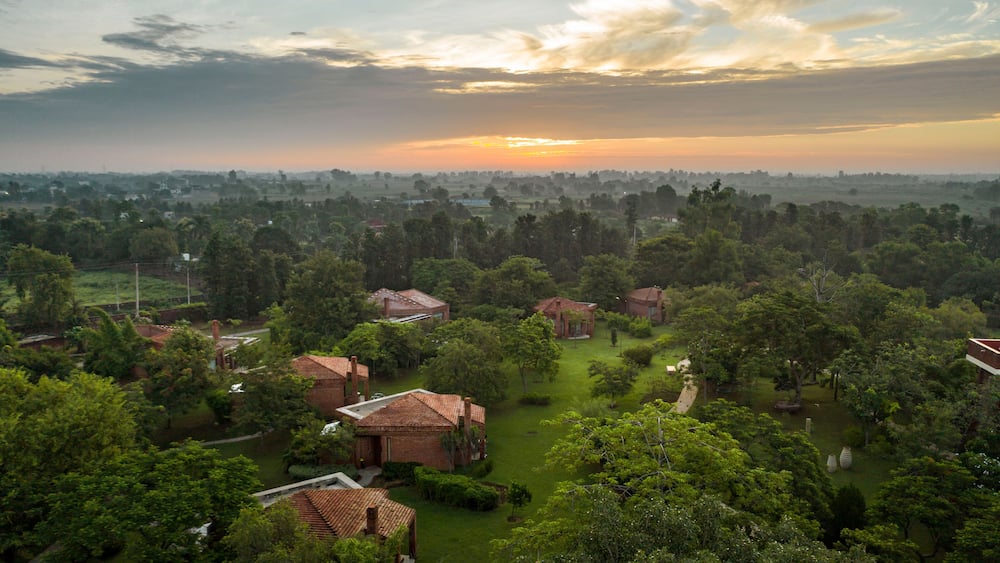 Aerial view of a few houses in a touristic resort in Karnki, Haryana, India.