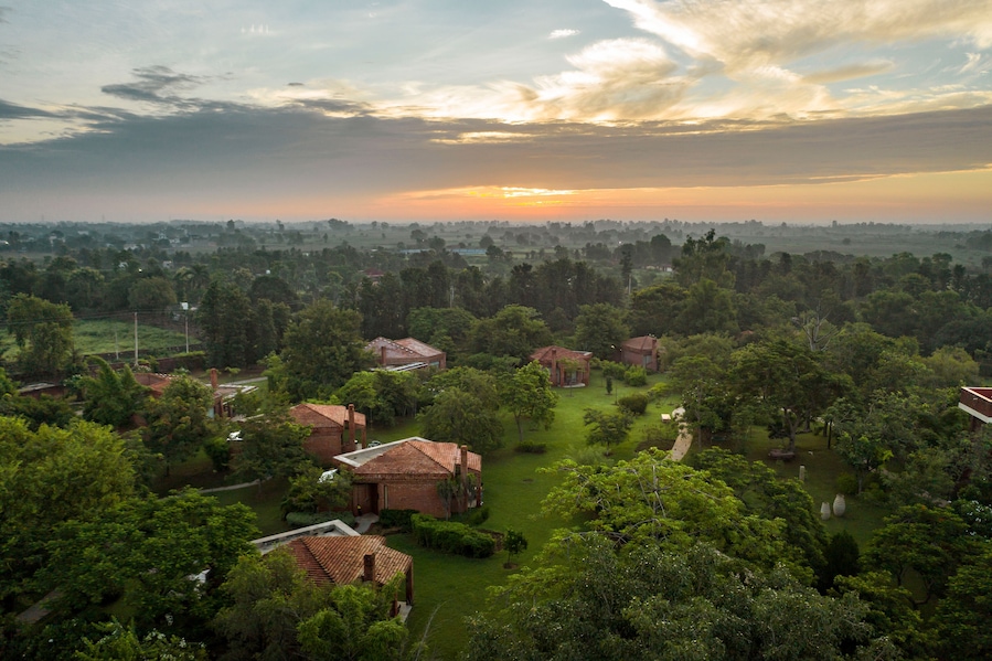 Aerial view of a few houses in a touristic resort in Karnki, Haryana, India.
