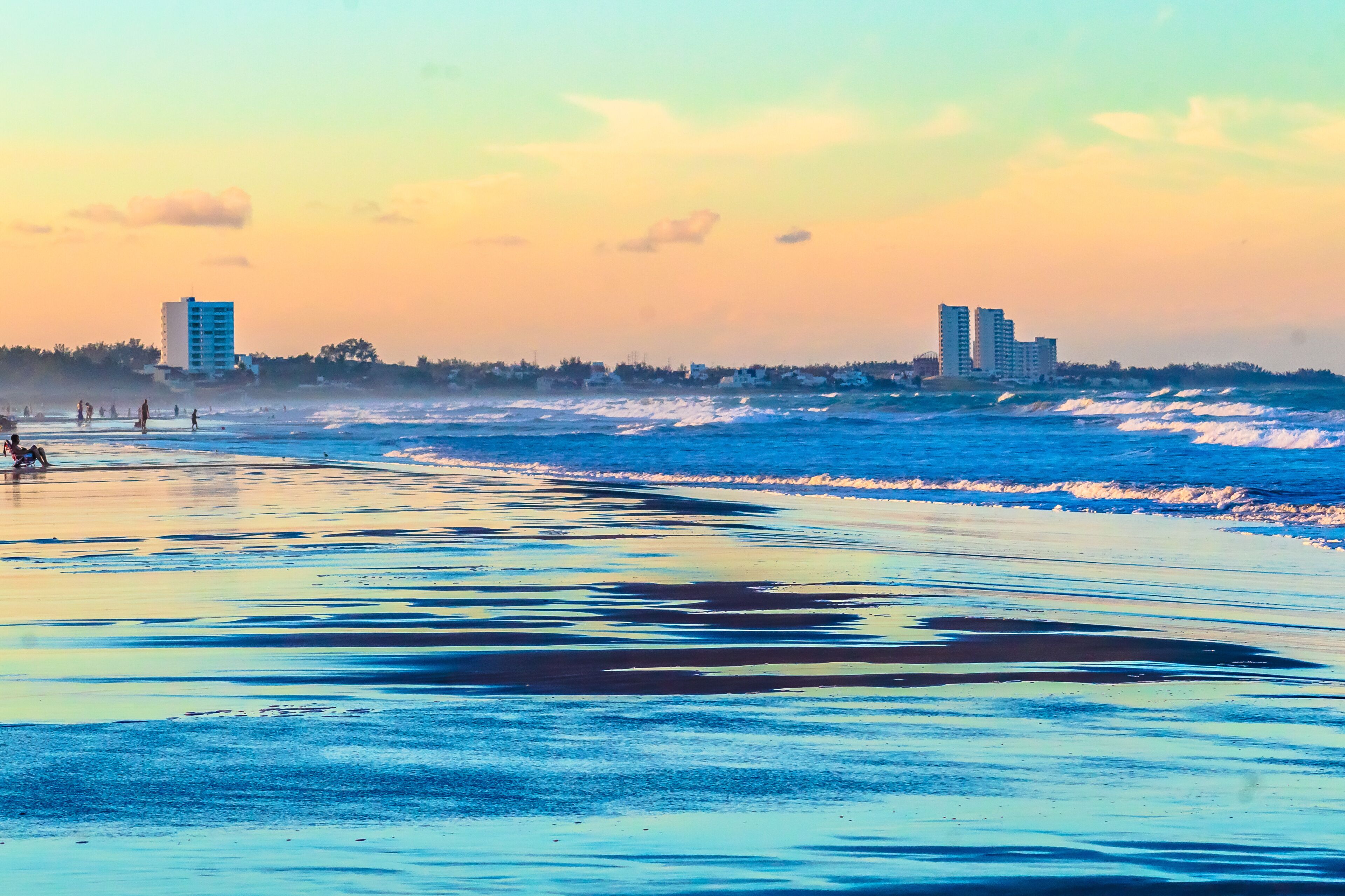 Beach at sunset with buildings in the background at Miramar Beach in Tampico Madero Tamaulipas 