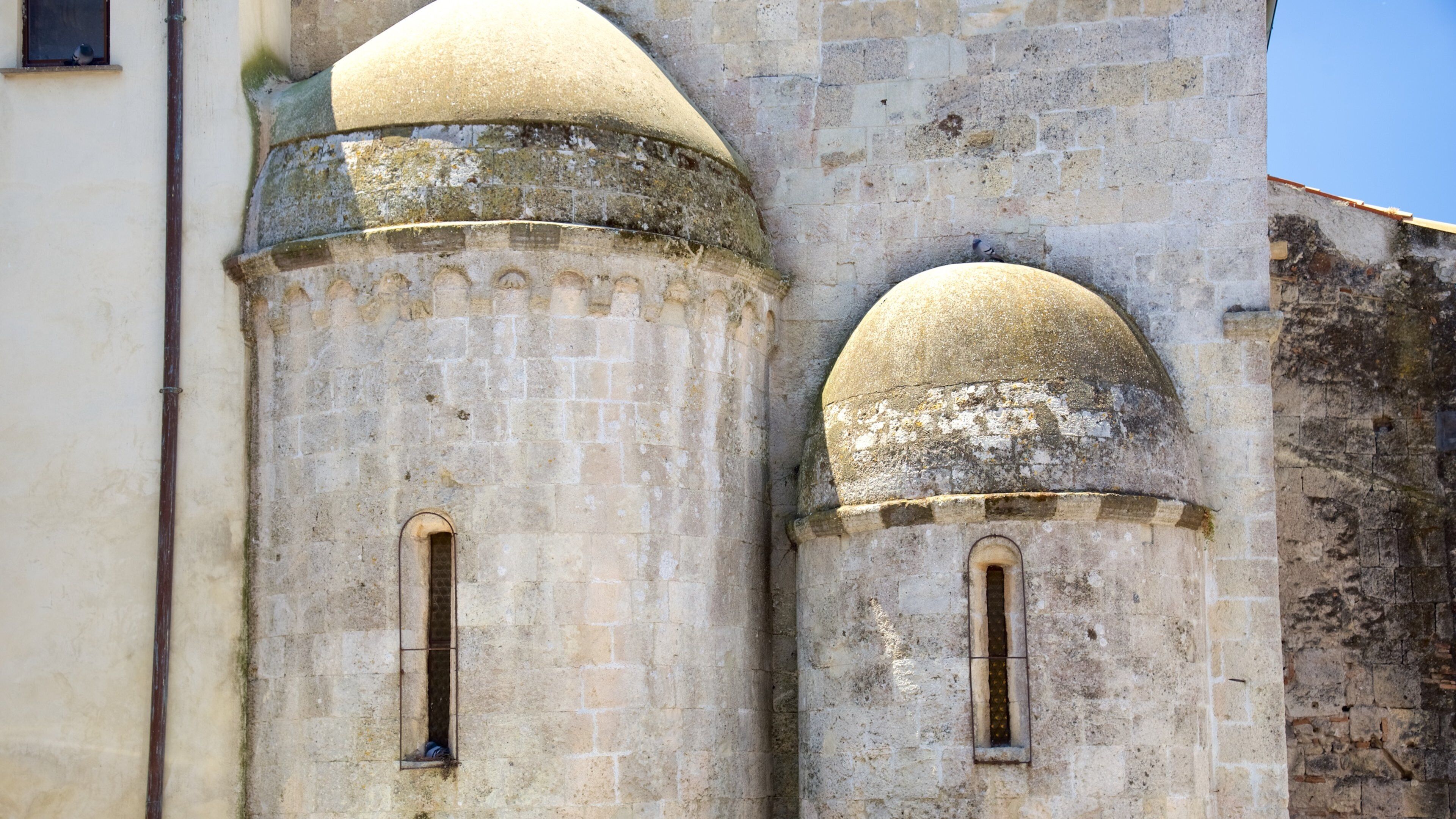 A stone tower with arched windows and a dome.