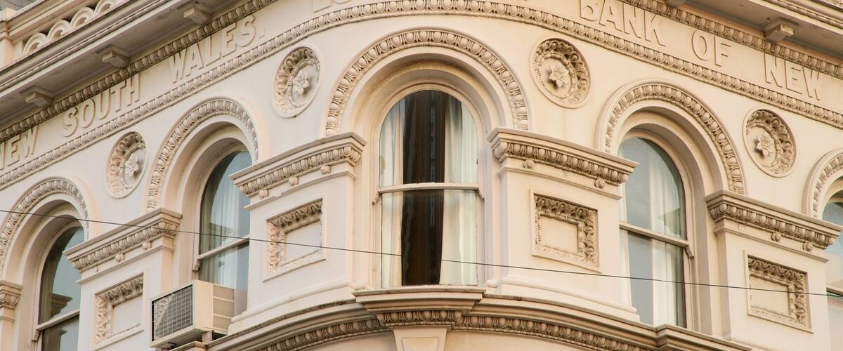 A building facade with ornate carvings and the inscription "South Wales Bank 1817".