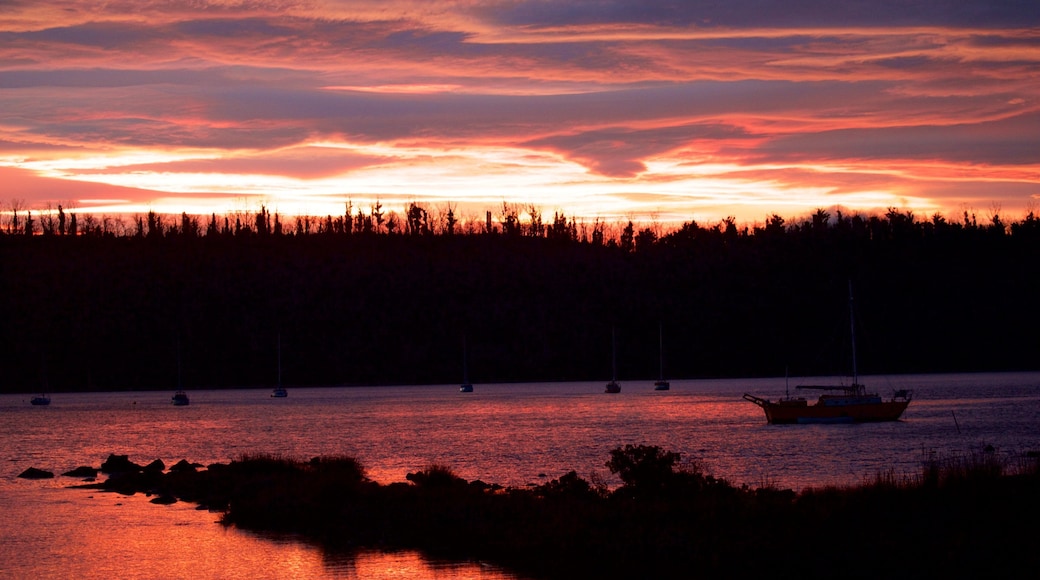 Tasman Peninsula which includes general coastal views and a sunset
