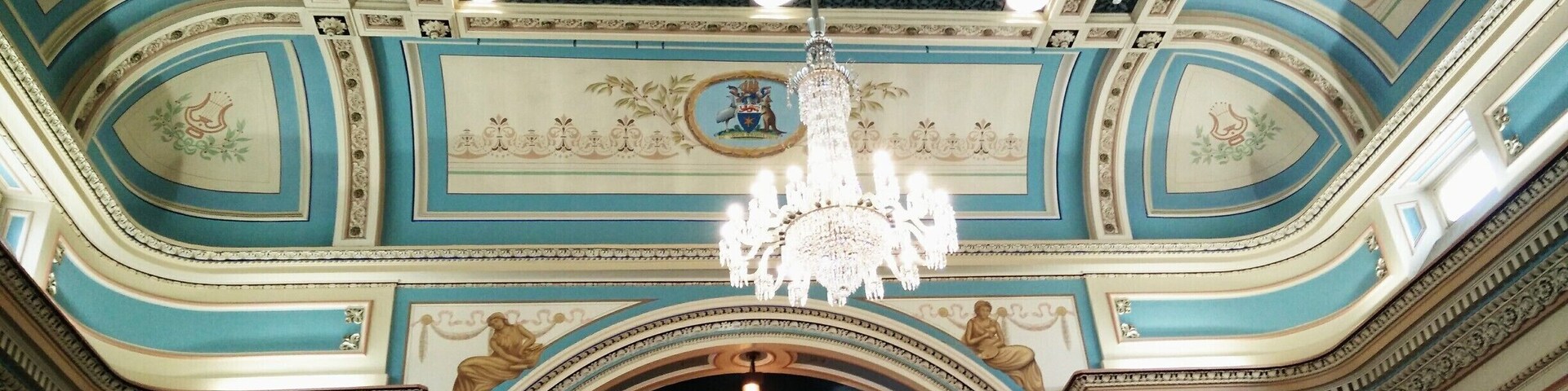 You would be hard pressed to find a more pleasing and historic interior than that from the main ballroom of Hobart's 1866 Town Hall.
It is amazing to think that as well as the Council Chambers (a function it still performs today), it also once held police cells, courthouse, and the foundation State Library of Tasmania.
Undergoing many renovations throughout its long life, the interior of the ballroom is set off by the last addition, splendid chandeliers.