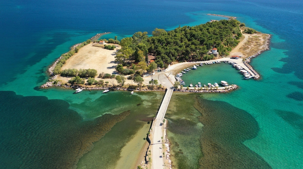 Aerial drone ultra wide photo of famous island of dreams or Pezonisi connecting with small road with seaside fishing village of Eretria, Central Evia island, Greece