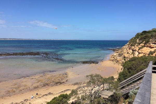 Walk down the stairs, walk in the water and around the Bluff for a great little beach in the marine park ( take your snorkels)