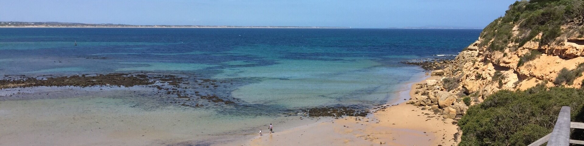 Walk down the stairs, walk in the water and around the Bluff for a great little beach in the marine park ( take your snorkels)