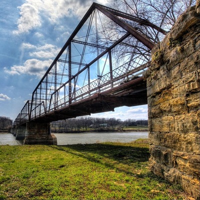 Found this bridge while exploring. It used to be a railroad bridge, transformed to a buggy bridge, and not after restoration is a walking path bridge. It stretches over a hundred feet and while walking you can still see the old railroad and boards for the buggy.