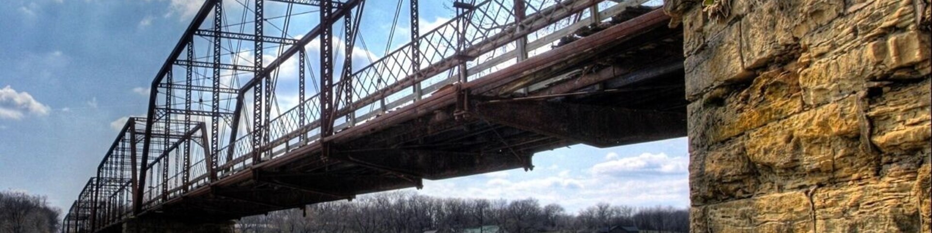 Found this bridge while exploring. It used to be a railroad bridge, transformed to a buggy bridge, and not after restoration is a walking path bridge. It stretches over a hundred feet and while walking you can still see the old railroad and boards for the buggy.