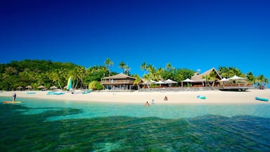 Castaway Island showing a sandy beach, a luxury hotel or resort and tropical scenes