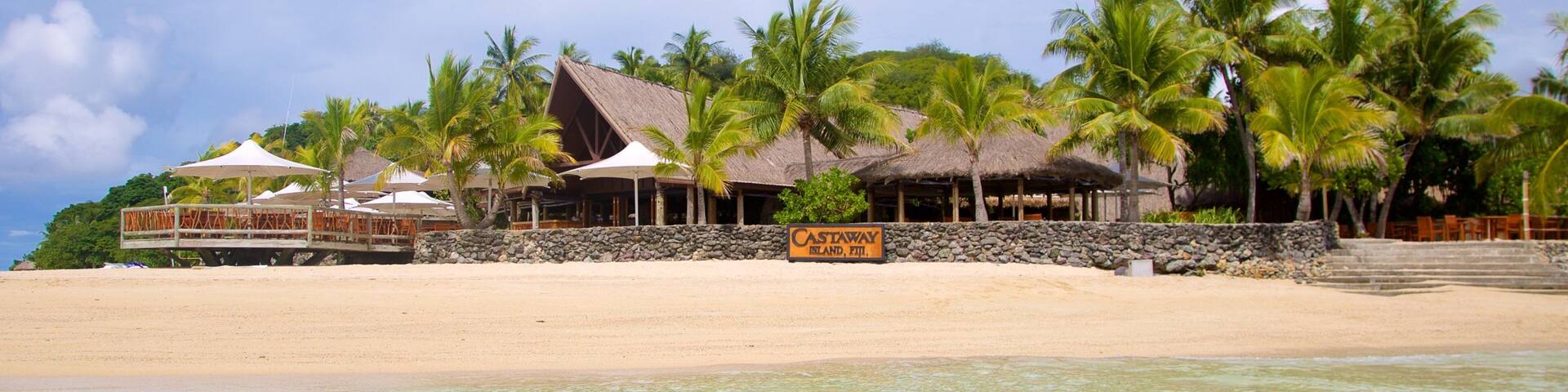 Castaway Island showing a beach and tropical scenes