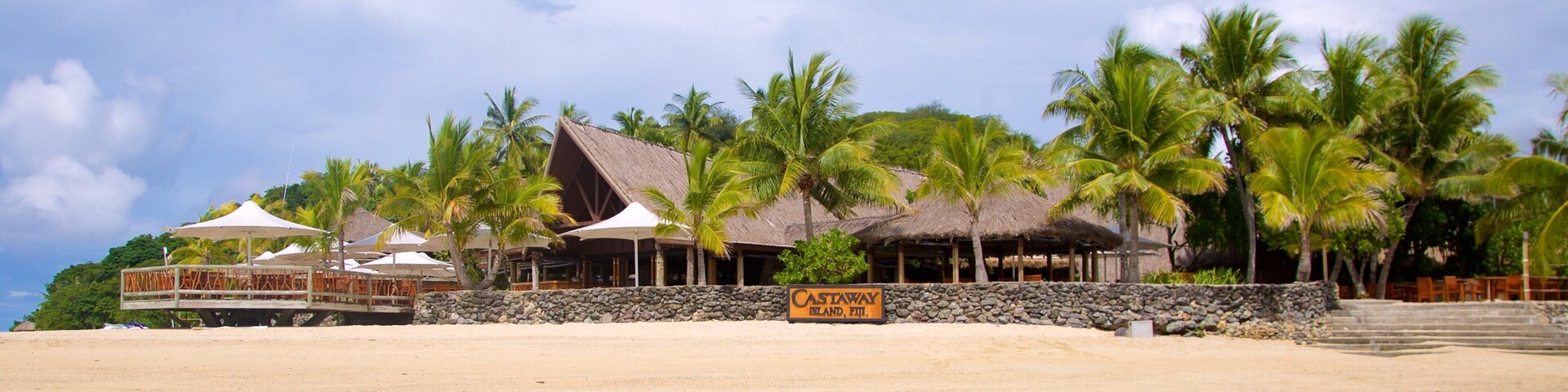 Castaway Island showing a sandy beach and tropical scenes