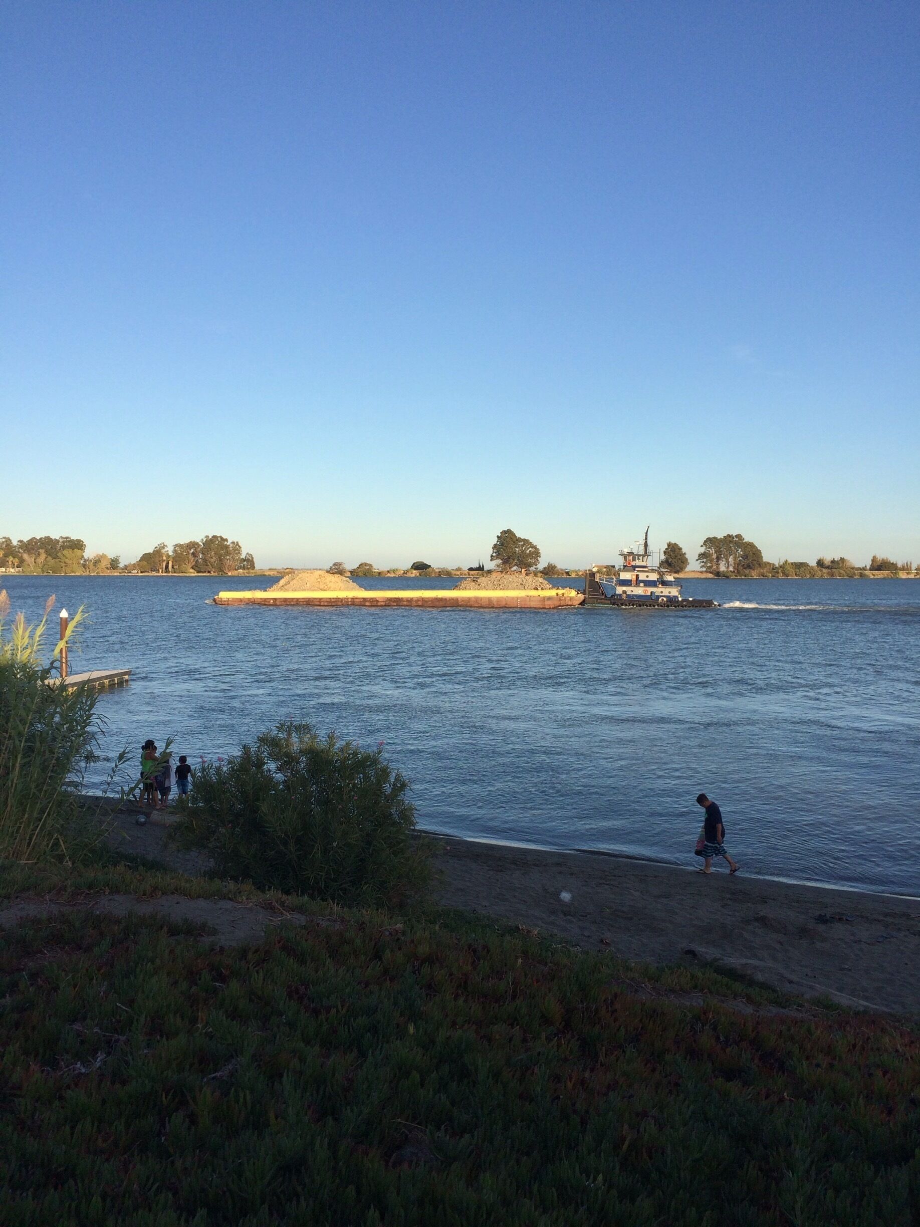 Gravel barge going down the river