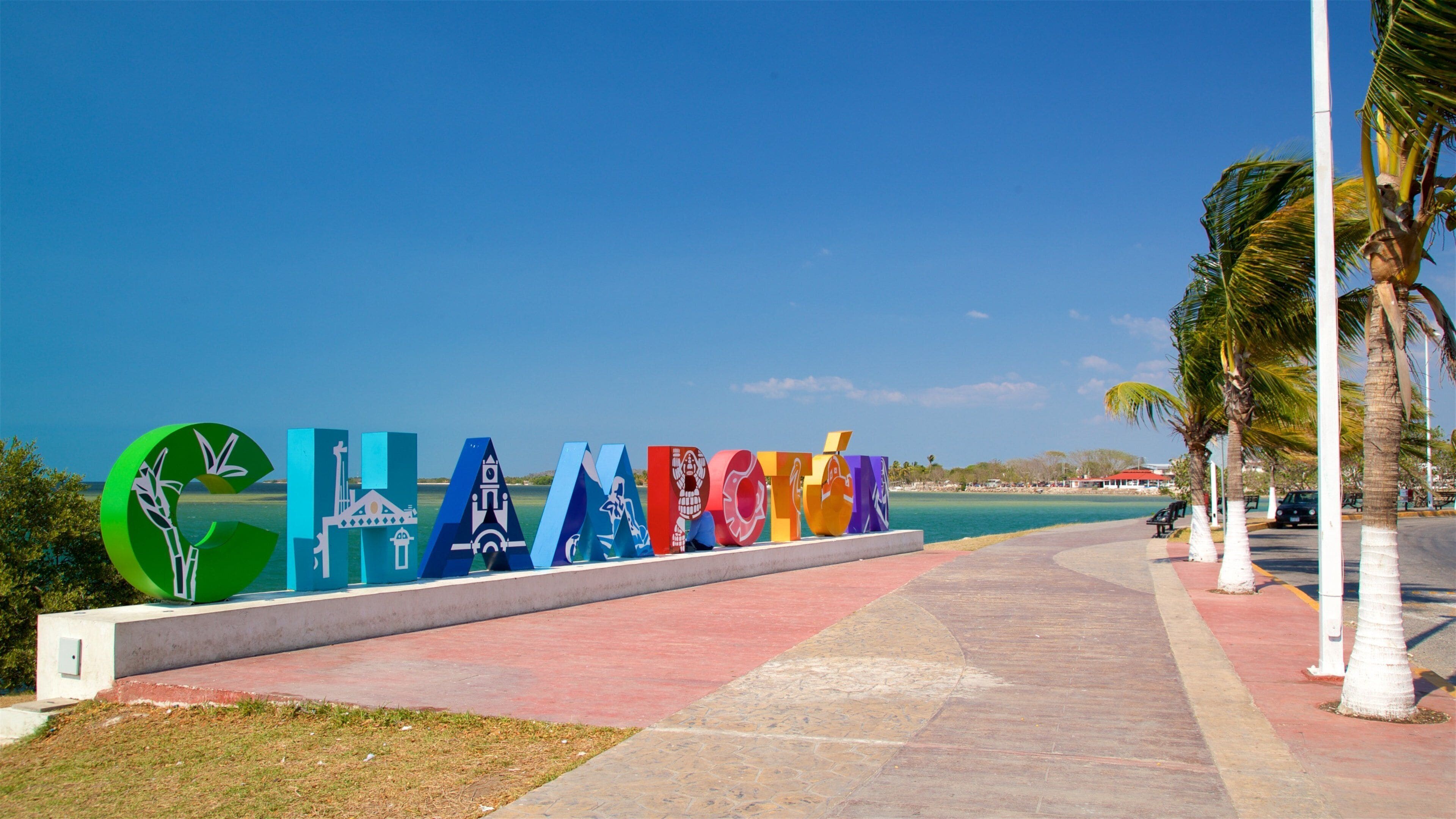 Champotón que incluye escenas tropicales, señalización y vistas generales de la costa