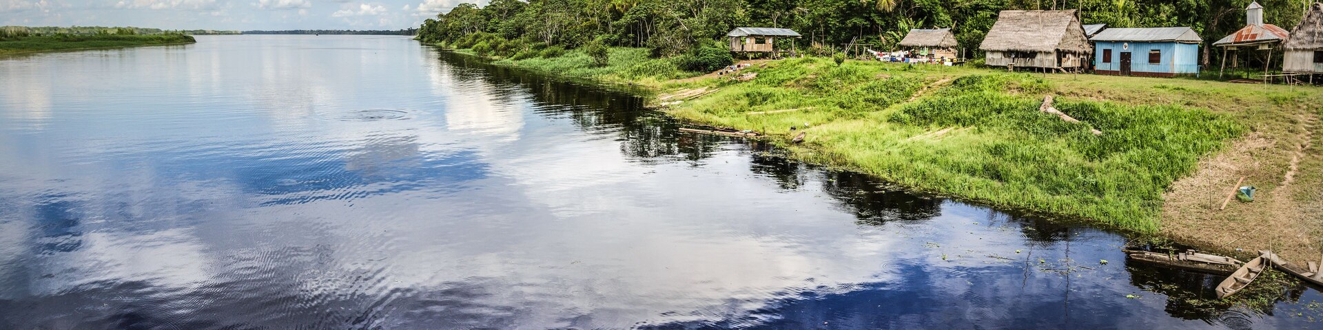 Reflection of the cloud on a black water tributary river of the Amazon.