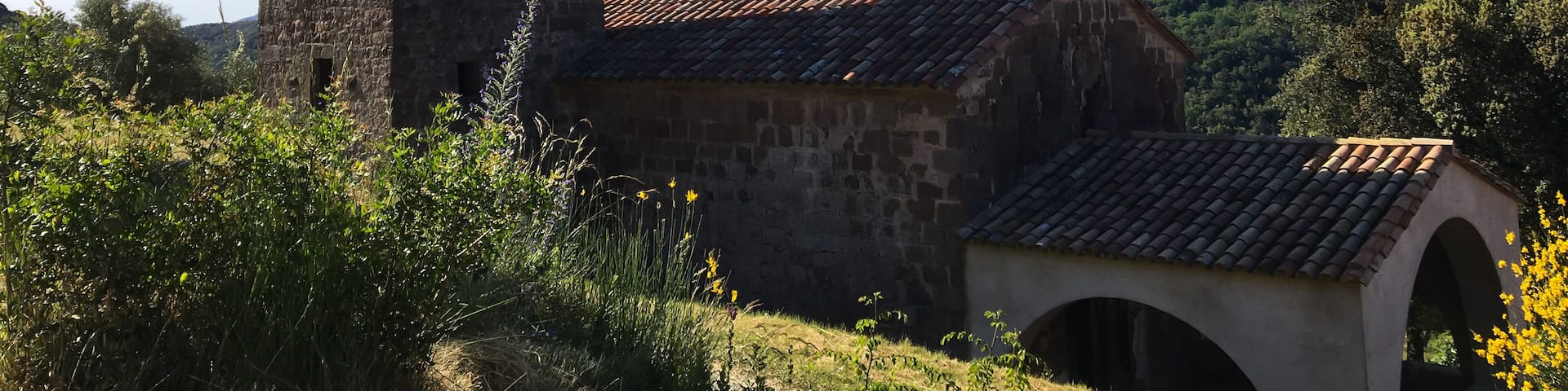 Rural romanic church bell tower in Sant Ferriol