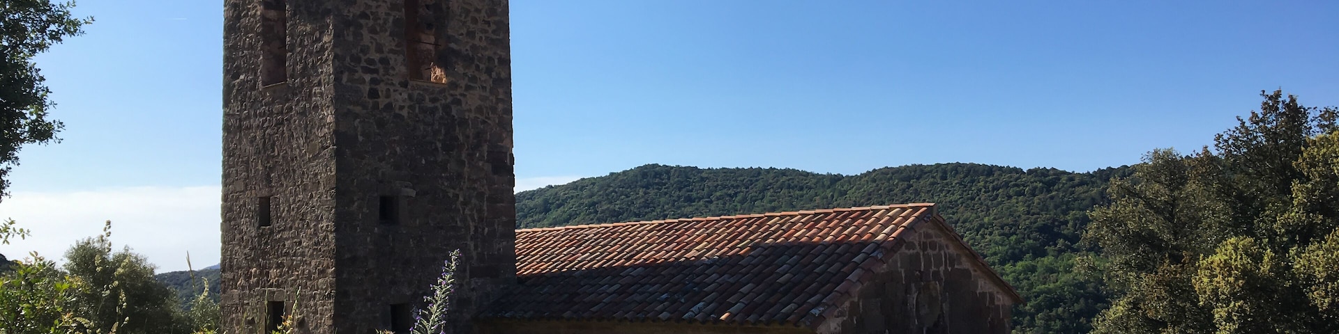 Rural romanic church bell tower in Sant Ferriol