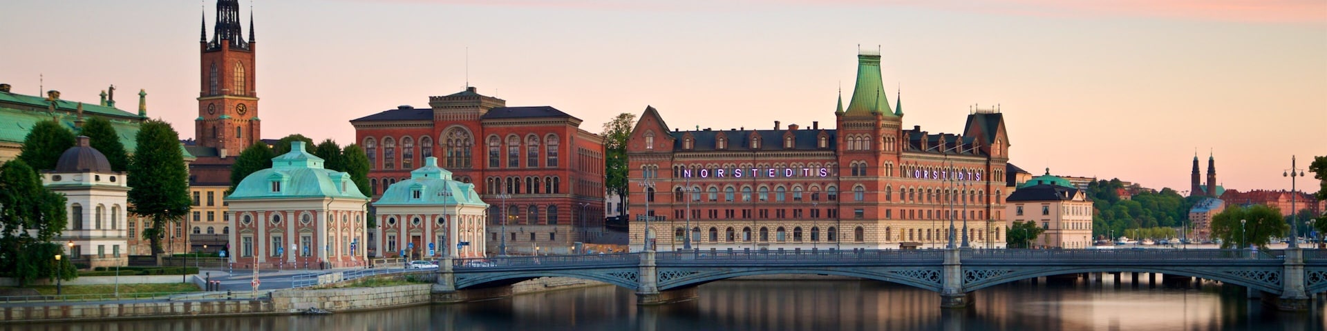 Gamla Stan which includes a bridge, a city and a river or creek