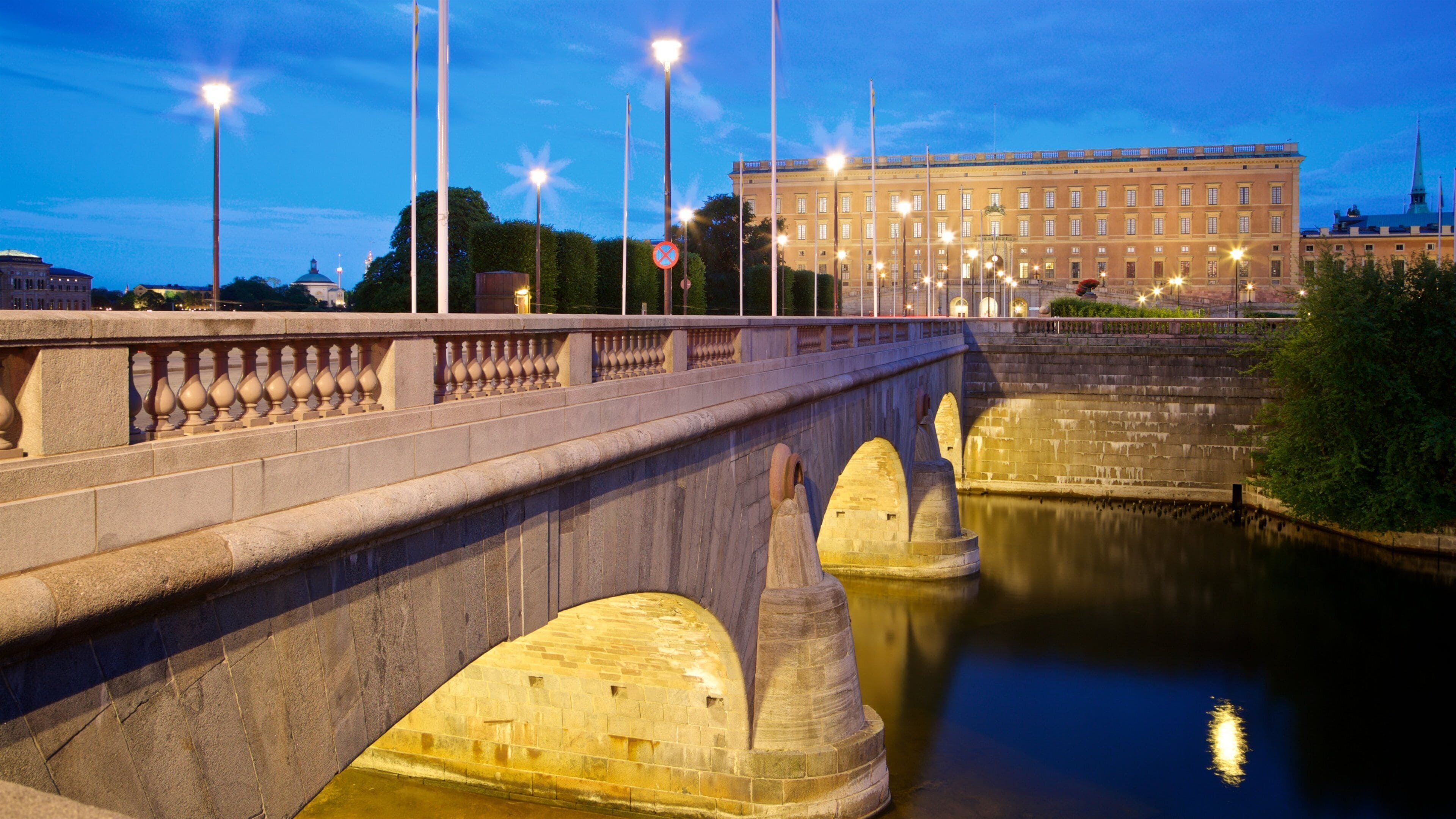 Gamla Stan which includes a river or creek, a bridge and night scenes