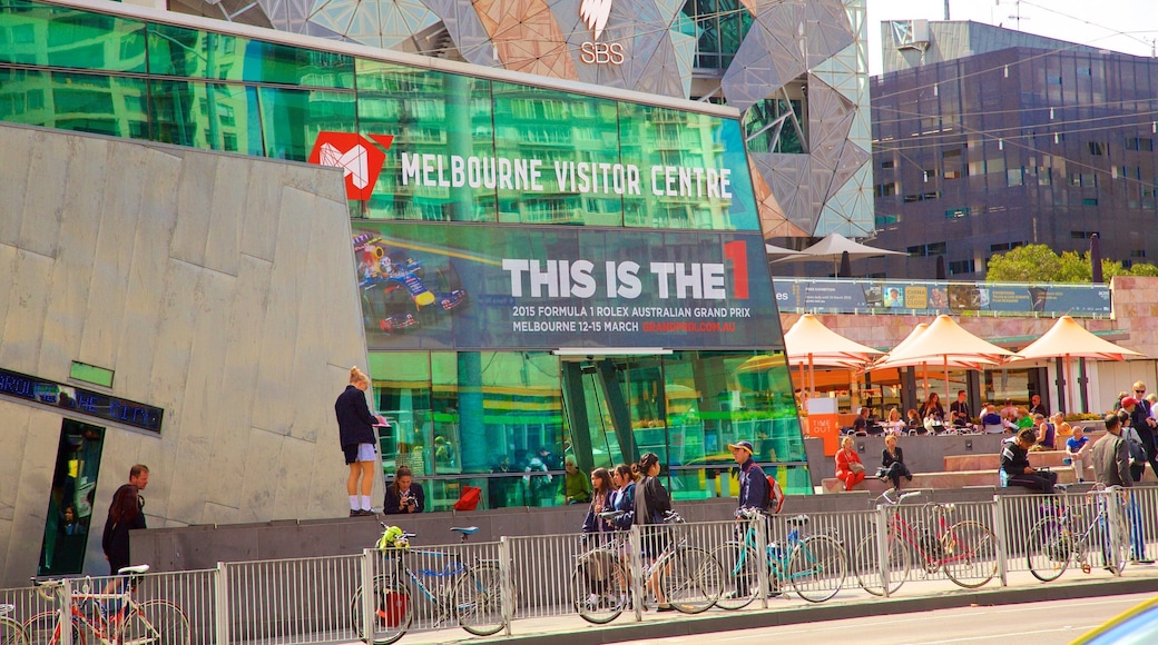Federation Square which includes a square or plaza as well as a large group of people