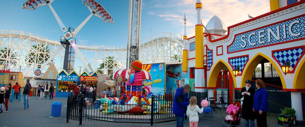 Luna Park showing rides as well as a family