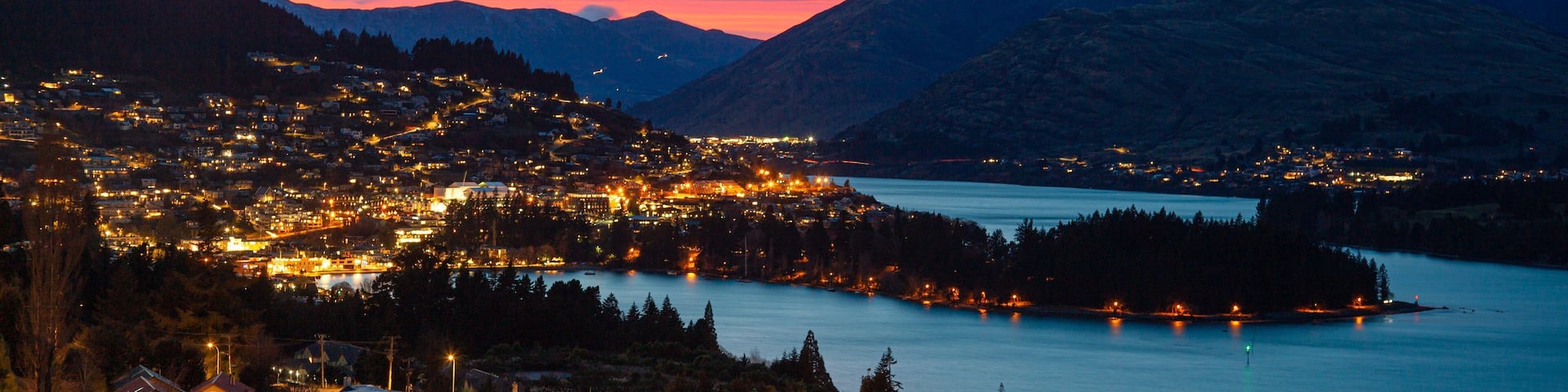 Fernhill showing a city, a sunset and night scenes