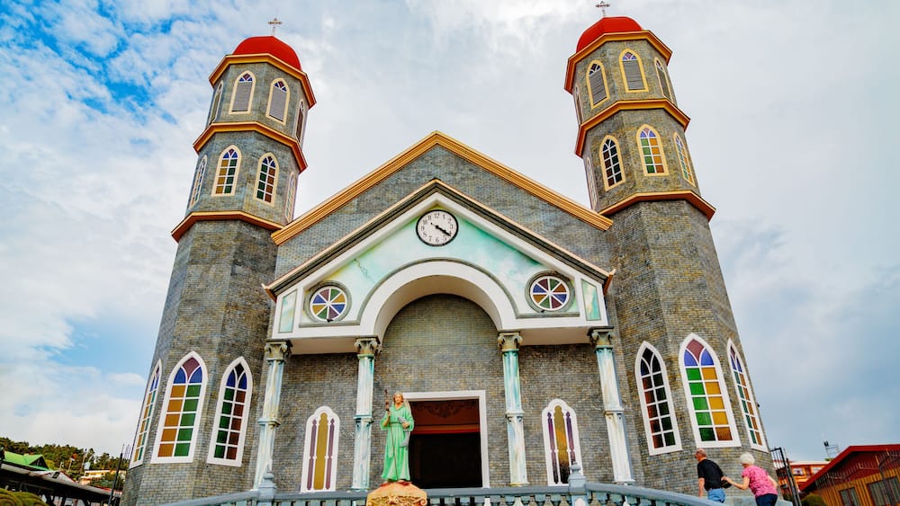 San Pablo, Costa Rica - April 3, 2017: Church of Archangel Gabriel and sculpted gardens of San Rafael de Heredia Park