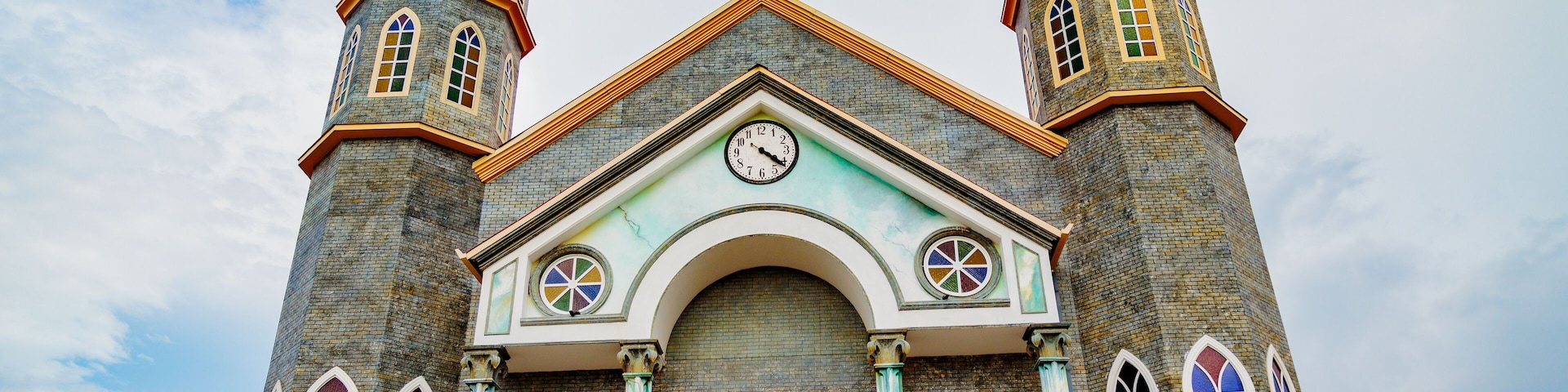 San Pablo, Costa Rica - April 3, 2017: Church of Archangel Gabriel and sculpted gardens of San Rafael de Heredia Park