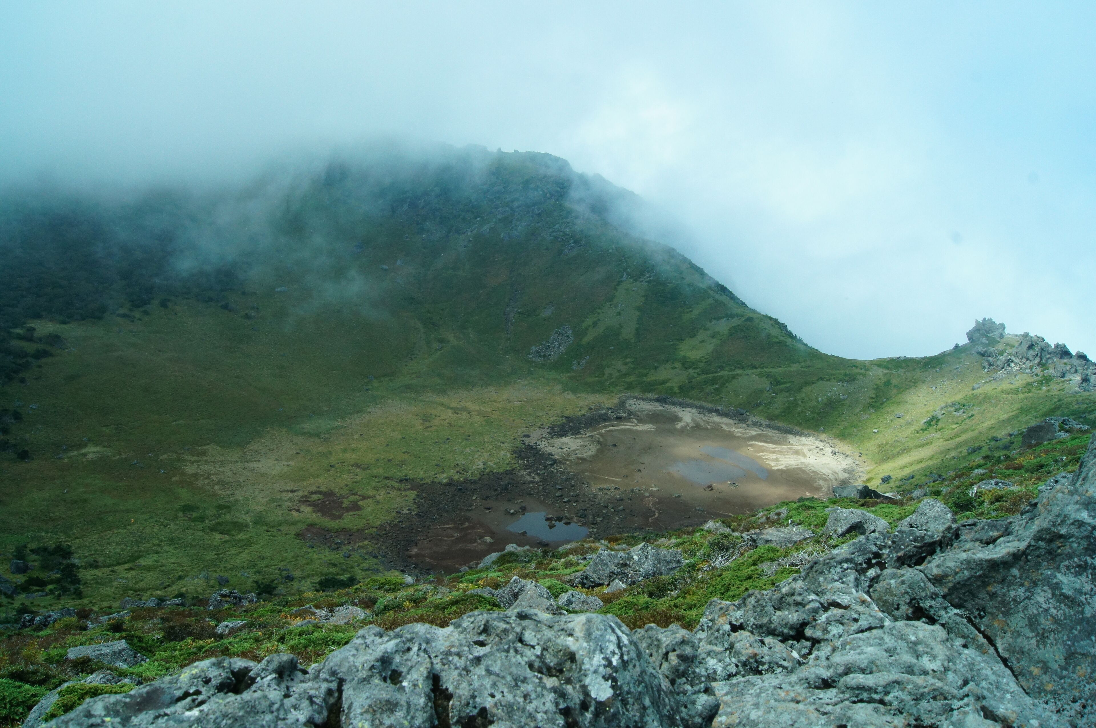 A view of the lake within Hallasan's inactive volcanic crater.