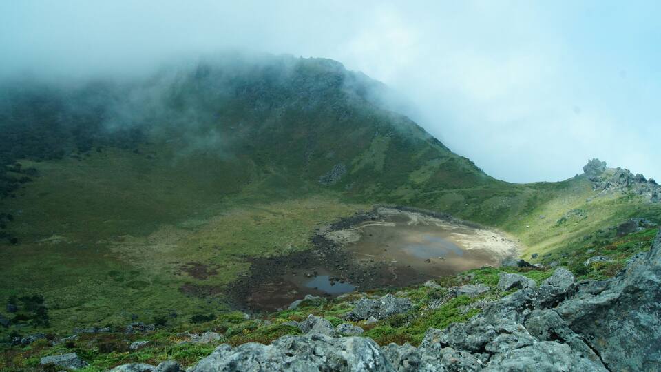 A view of the lake within Hallasan's inactive volcanic crater.
