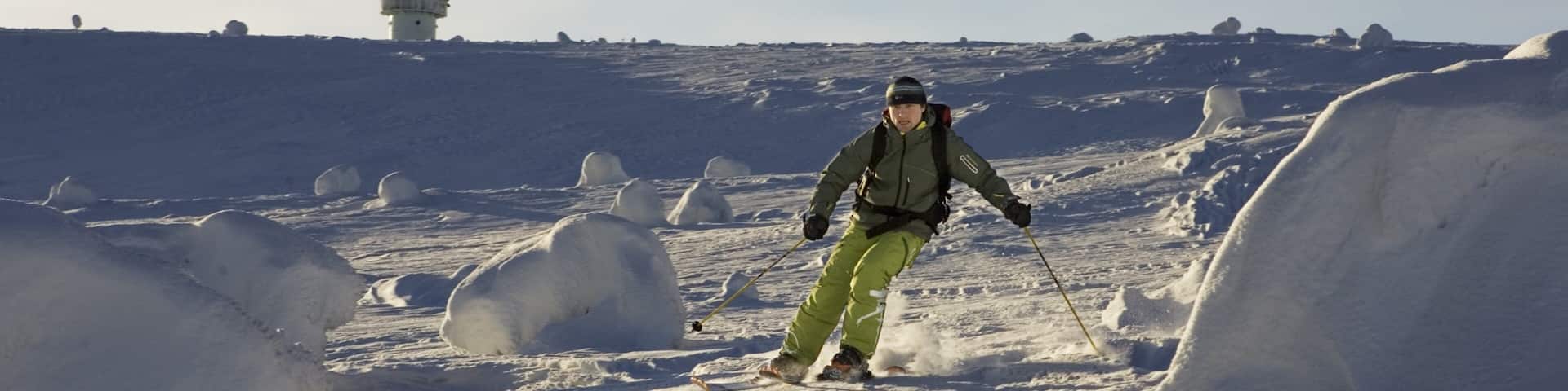 Luosto showing snow skiing and snow as well as an individual male
