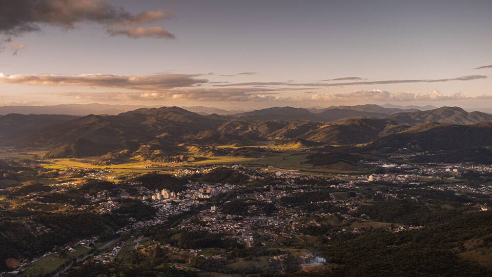 A mountainous landscape with a town nestled in the valley.