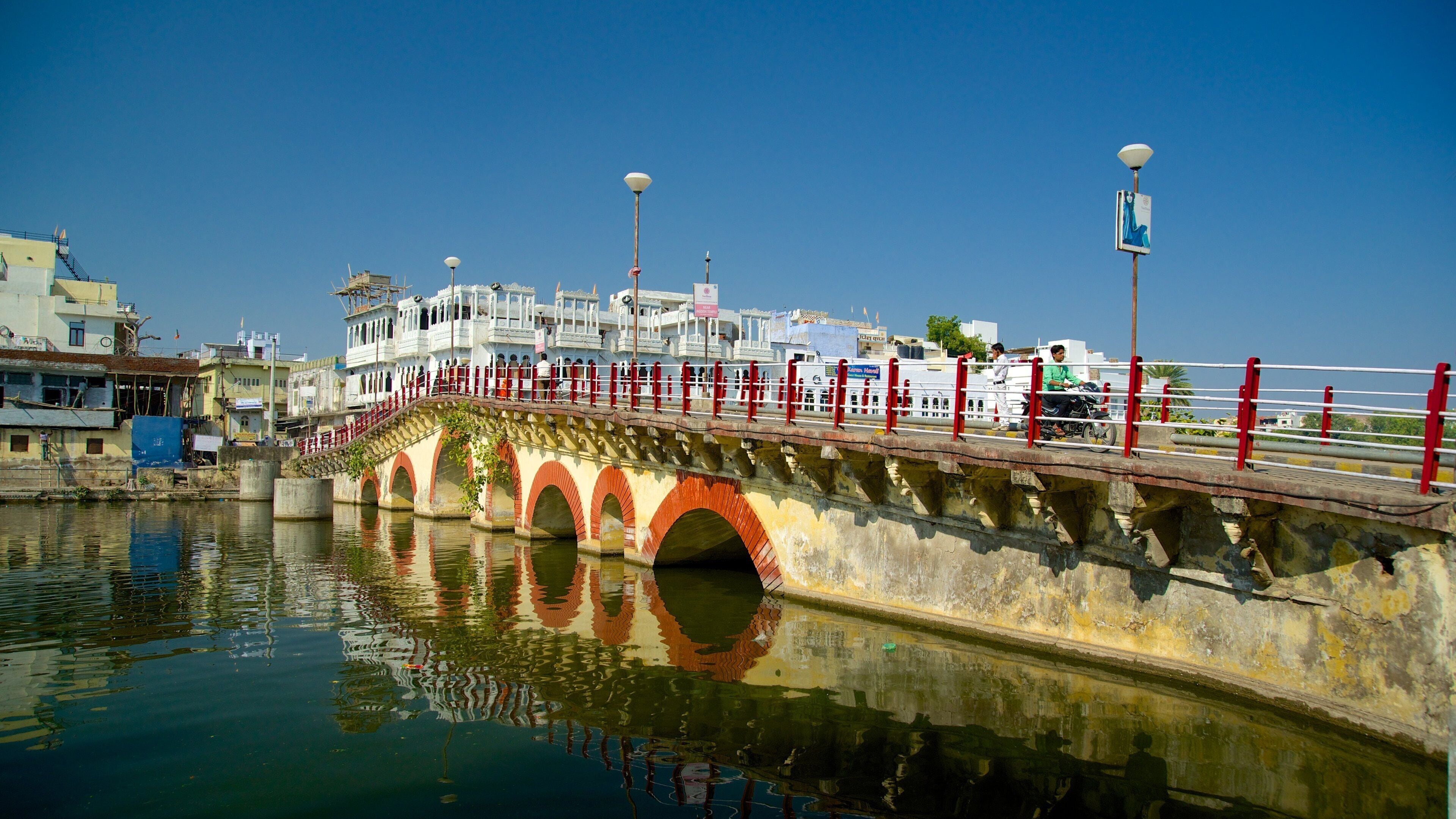 Udaipur showing a river or creek and a bridge