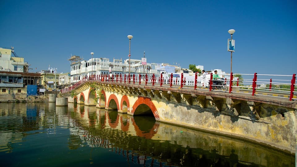 Udaipur featuring a bridge and a river or creek
