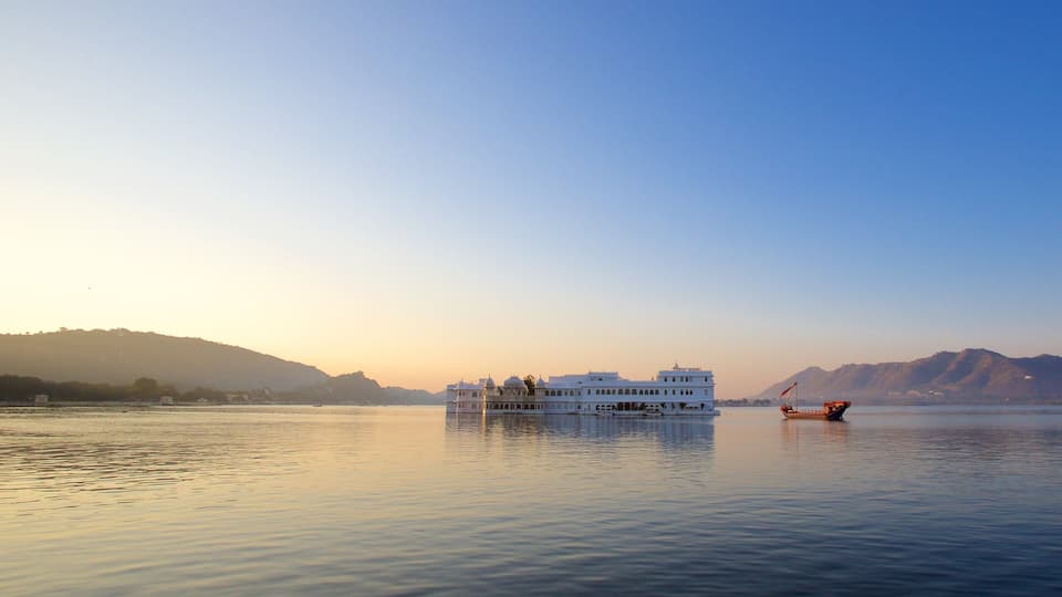 Udaipur District showing island images, a sunset and a lake or waterhole