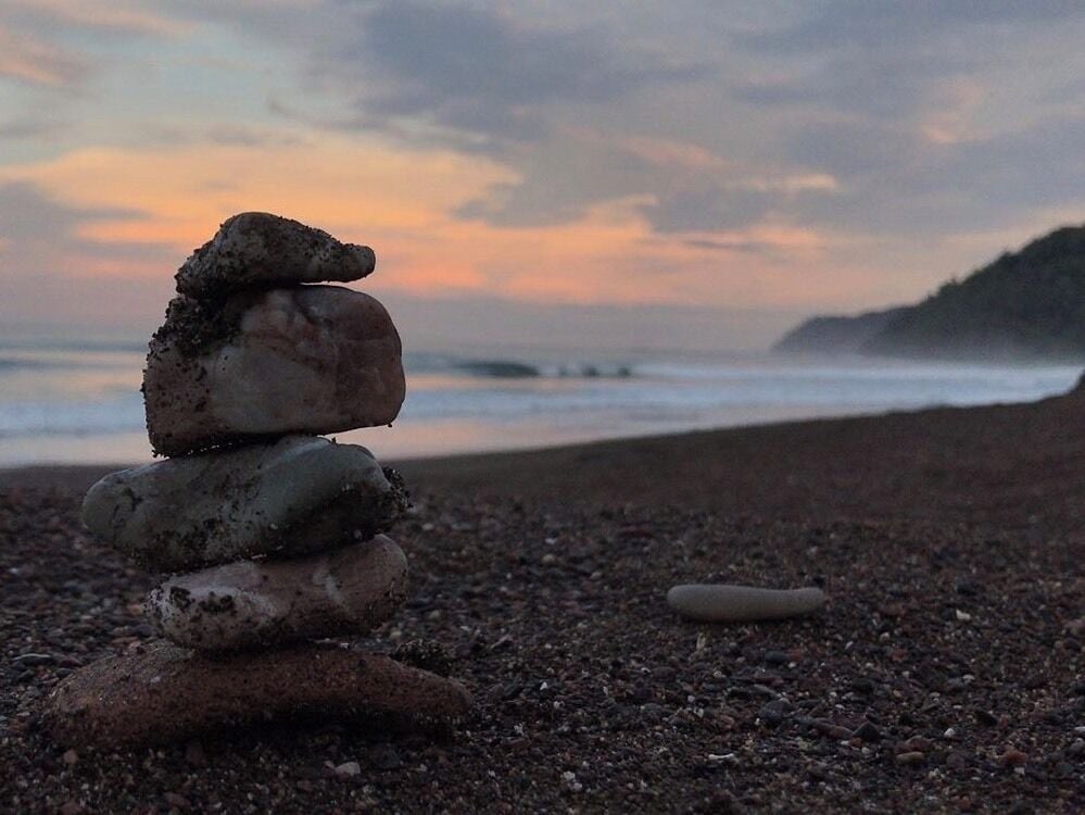 pura vida means 5 AM sunrises, black sand beaches, and rock stacking.

#Adventure Photo Contest